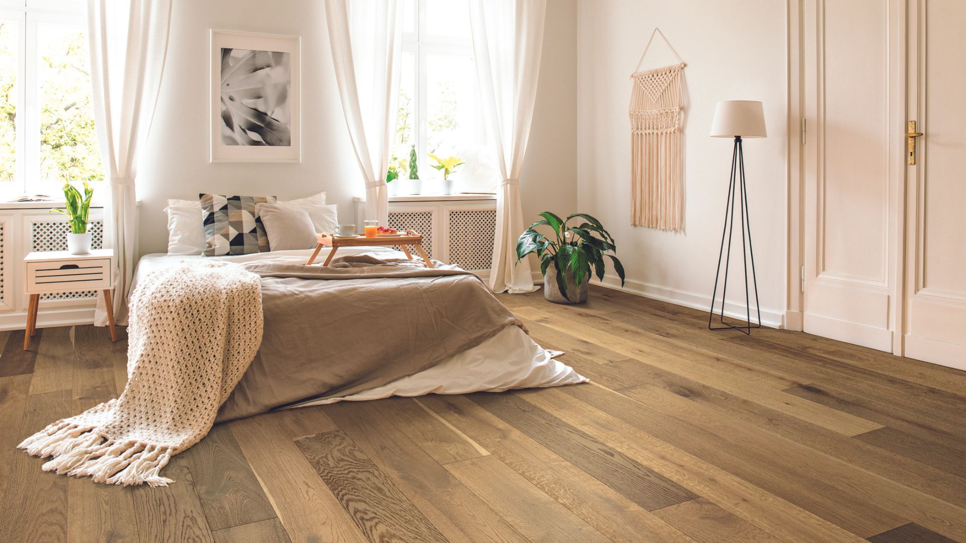 Luxury vinyl plank flooring in a bedroom.